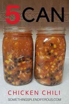 two jars filled with chicken chili sitting on top of a counter next to each other