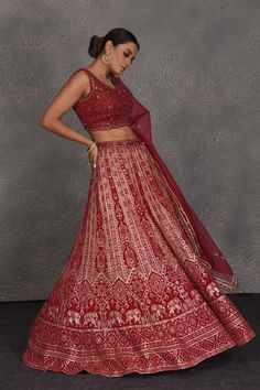 Be the center of attraction at weddings in this beautiful red embroidered designer lehenga. It comes with a matching net dupatta. DISCLAIMER: The actual product may vary slightly from the image. These are custom orders, hence expect slight variation in color and placement of the motif or buta. ESTIMATED DELIVERY: Because this is a custom order, it would take about 4 weeks from the date of purchase. RETURN POLICY: This product is a custom order and cannot be returned or exchanged. Red Embroidered Fabric With Sheer Dupatta For Reception, Red Semi-stitched Lehenga With Sheer Dupatta, Semi-stitched Red Lehenga With Intricate Embroidery, Red Anarkali Lehenga With Intricate Embroidery, Red Embroidered Lehenga For Reception, Red Embroidered Fabric With Sheer Dupatta For Diwali, Red Floor-length Embroidered Fabric For Reception, Floor-length Red Embroidered Fabric For Reception, Red Floor-length Lehenga With Resham Embroidery