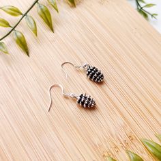 I T E M * D E S C R I P T I O N  -dainty silver tiny pinecone dangle earrings  -925 sterling silver hypoallergenic hooks  -.5 inch drop length  -a perfect gift for a nature lover, gardener, or mom!  ---------------------------------------------- Check out our other earrings here:  https://needfulthingsthrift.etsy.com?section_id=46781030 Check out our homepage here:  https://needfulthingsthrift.etsy.com M A T E R I A L S Silver tiny pinecone pendants, 925 sterling earring hooks, rubber backs for backs of earring hooks Please note, this item is handmade and may be slightly different each time it is made, But I assure that it is very close to what you see in photos All jewelry is handmade with love, designed and created by us. We are lovers of jewelry and fashion, that is why we put so much e Outdoor Nature Wedding, Wedding Earthy, Pinecone Earrings, Pinecone Pendant, Earring Simple, Tree Hugger, Nature Wedding, Earring Hooks, P T