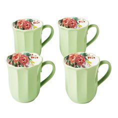 four green cups with floral designs on them