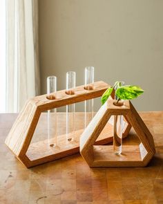 a wooden table topped with glasses and a plant