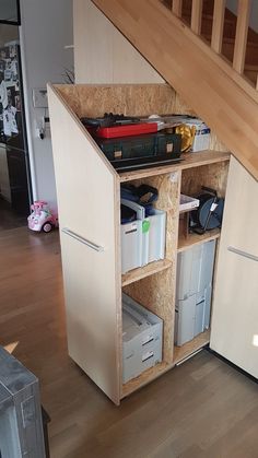 an under the stairs storage unit in a house