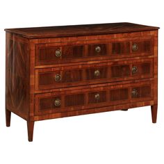 a wooden dresser with three drawers and two handles