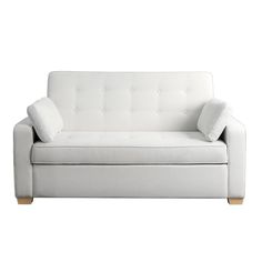 a white couch with two pillows on it