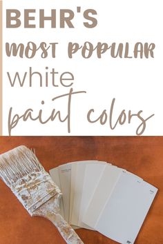 a paint brush with white paint on it and the words behr's most popular white paint colors