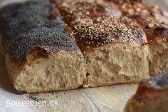 a loaf of bread with sesame seeds on top