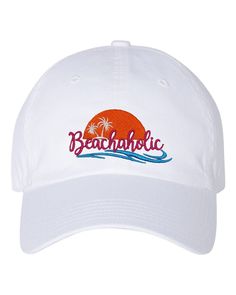 "Beachaholic beach lover embroidered cap with colorful ocean wave and palm trees and sun on a cotton twill cap, one size.  100% cotton twill cap-6-panel-unstructured-Vacation Hat-Mens or Womens cap for beach vacation lover gift unisex ball cap.  Colors can be change to suit color of hat chosen. Anvil Brand Adult Solid Low-Profile Twill  Features: *100% cotton twill *6-panel, low-profile *unstructured with top button and two metal grommets on side panels *matching color sweatband *fabric closure Beach Cotton Baseball Cap, Cotton Beach Baseball Cap, White Visor Trucker Hat For Beach, Cotton Baseball Cap For Beach, White Trucker Hat For Beach Season, Cotton Snapback Trucker Hat For Vacation, Trendy Beach Baseball Cap With Curved Bill, Trendy White Baseball Cap For Beach, Cotton Curved Brim Baseball Cap For Vacation