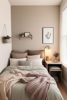 a bed sitting in a bedroom under a window next to a nightstand with a lamp on it