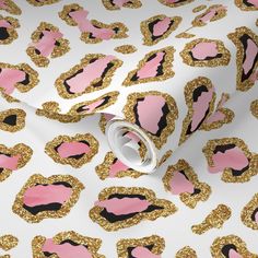 pink and gold leopard print wallpaper with black spots on white background, close up