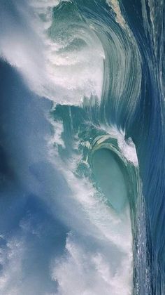 an ocean wave is breaking into the water and it looks like something from outer space