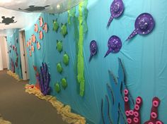 the hallway is decorated with sea creatures and underseam paper decorations on the walls