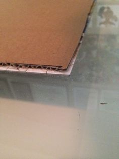 a piece of cardboard sitting on top of a table