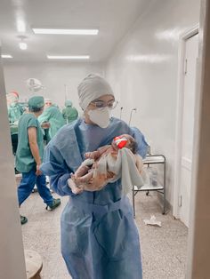 doctors in scrubs and masks are preparing to perform surgery