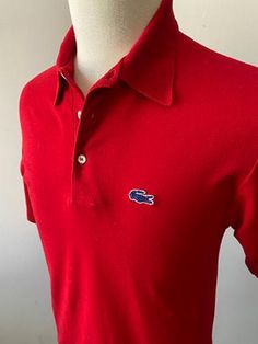 Look stylish in this classic Izod Lacoste polo shirt. Very good condition. Listed size large, but more like a medium/small.  65% poly 35% cotton. Made in USA. Chest: 38", Length: 29" Very good condition. No obvious flaws. Casual Red Polo Shirt With Collared Neckline, Red Casual Polo Shirt, Casual Red Polo Shirt, Casual Red Collared Polo Shirt, Izod Lacoste, Polo Lacoste, Lacoste Polo Shirts, Lacoste Polo, Vintage Polo