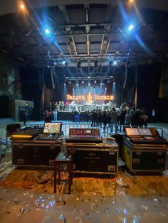 the stage is set up for an event with sound equipment and people in the background