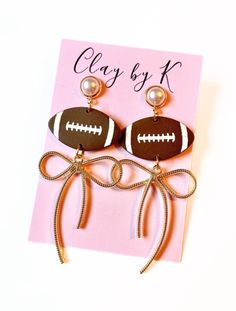 football clay earrings, perfect for gameday!  Hypoallergenic posts. Handmade from polymer clay. Mom Sports Clay Earrings, Football Clay Earrings, Clay Football Earrings, Clay Sports Earrings, Football Jersey Clay Earrings, Palmer Clay, Mom Earrings, Football Earrings, Football Lover