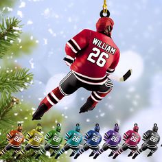 an ornament is hanging from a christmas tree in the shape of a hockey player