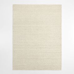 a white square rug on top of a floor