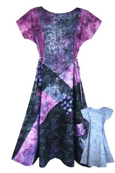 a purple and black dress with an abstract design on the front, in different colors