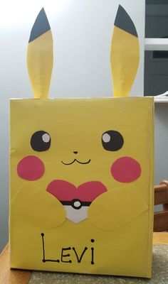 a paper bag with an image of a pikachu's face on it