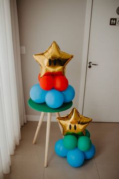 two star shaped balloons sitting on top of each other