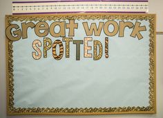 a bulletin board with the words great work spotted on it and an arrow pointing up