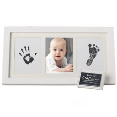 a baby's hand and foot prints in a white frame