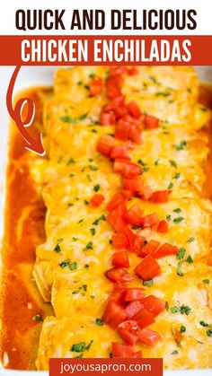 an enchilada with tomatoes and cheese in a white casserole dish