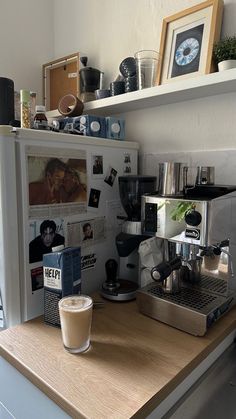 a coffee maker sitting on top of a wooden counter