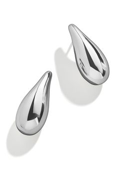 Enhance your elegant style with the soft glow of these sculptural teardrop earrings. 1 1/4" drop; 1/2" width Post back Goldtone plate or silvertone plate or goldtone plate/glass crystal Imported Evening Drop Earrings With Polished Finish, Modern Teardrop Drop Earrings Tarnish Resistant, Modern Metal Teardrop Earrings For Formal Occasions, Modern Teardrop Earrings With Polished Finish, Elegant Silver Teardrop Earrings Tarnish Resistant, Modern Silver Teardrop Earrings Tarnish Resistant, Classic Metal Teardrop Earrings For Formal Occasions, Teardrop Earrings With Polished Finish For Evenings, Evening Teardrop Earrings With Polished Finish