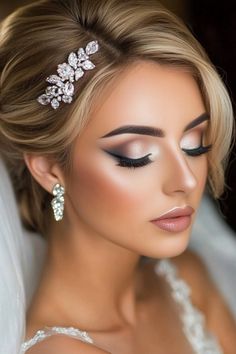 Bride with elegant makeup, rhinestone hair accessory, and earrings. Full Coverage Bridal Makeup, Full Face Wedding Makeup, Stunning Makeup For Brown Eyes, Arab Wedding Makeup, Bridal Makeup Winter, Spring Bridal Makeup, Elegant Bridal Makeup Brown Eyes, Neutral Glam Makeup, Wedding Makeup Inspiration