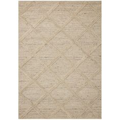 a beige rug with diamond shapes on it