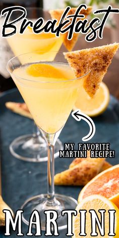 the martini is garnished with orange slices