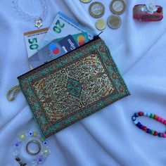 the purse is full of money, beads, and other things to put in it