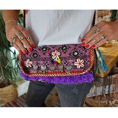 Introducing our unique bohemian Handmade Indian Unique Textile Bag, crafted with vintage clothes and textiles for a truly one-of-a-kind accessory. Each bag is carefully handmade, ensuring that no two are exactly alike. The vibrant colors and intricate designs of the vintage textiles make for a stunning and eye-catching bag that is perfect for adding a pop of color to any outfit.  Order yours today and enjoy a unique piece that celebrates the beauty of vintage textiles. Indian banjara clutch Vint Indian Clutch, Boho Clutch Bag, Bohemian Clutch, Embroidered Clutch Purse, Boho Textiles, Boho Style Bag, Ikat Bag, Boho Clutch, Colorful Bohemian