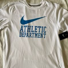 New With Tags Men’s Nike Shirt Short Sleeves, Regular Fit. White With Blue Graphic Men’s Size Medium. Offers Welcome! Bundle With Other Items For An Extra Discount! White Nike T-shirt With Text Print, Nike Mens Shirts, Nike Shirt, Blue Graphic, Dri Fit Shirt, Mens Short Sleeve Shirt, Nike Tshirt, Grey Nikes, Nike Tees