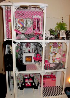 a doll house with all the furniture and accessories in it's display case is shown