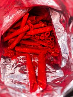 some red food is in a plastic bag