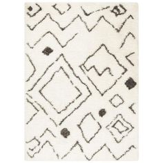 a rug with black and white designs on it