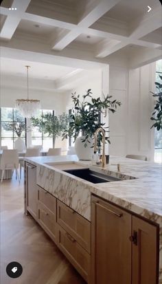 the instagram page shows an image of a kitchen with marble counter tops and wooden cabinets