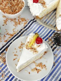 there is a piece of cake on the plate next to other desserts and utensils