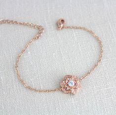 "NECKLACES NOT AVAILABLE IN ROSE GOLD Beautifully detailed rose gold flower bracelet is created with Rose Gold finish Swarovski Pure Brilliance floral rose component. Bracelet measures 6 inches and extends to 8 inches Flower measures 1/2\" in diametere Available in 3 finishes, rose gold, yellow gold or rhodium (silver). This is an original design by © Treasures by Agnes PLEASE ALLOW APPROX 3 DAYS FOR COMPLETION MATCHING PIECES: https://www.etsy.com/shop/treasures570?search_query=bella All pieces