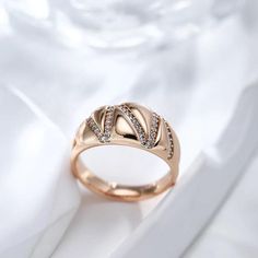 Style: Geometric Line Wide Statement Ring Type: Cocktail Rings Fine or Fashion: Fashion Setting Type: Tension Setting Shape\pattern: GeometricOccasions: Wedding / Dating / Anniversary / Daily wearing / Valentine's Day gifts Environmental Standard: Lead, Nickel, Cadmium free Metal: Copper Material: Cubic Zirconia Elegant Rose Gold Open Ring Wide Band, Elegant Rose Gold Wide Band Open Ring, Elegant Crystal Promise Ring With Metal Band, Elegant White Wide Band Promise Ring, Wedding Open Diamond Ring, Fine Jewelry Rose Gold Dome Ring For Wedding, Rose Gold Wide Band Ring For Wedding, Rose Gold Open Ring With Diamond Accents, Rock Rings