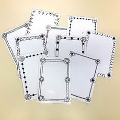 five blank papers with black and white designs on them