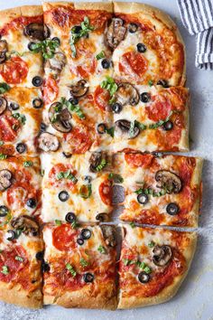 a pizza cut into eight slices on top of a table