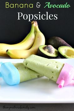 banana and avocado popsicles on a plate with some fruit in the background