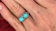 This fascinating twin turquoise cabochon ring is crafted of 18k white gold. This ring is currently a size 7.5. The turquoise show visible epoxy around the stones to help keep them secure. Brand Presentation, Old Boxes, Cabochon Ring, December Birthstone, High Quality Jewelry, Estate Jewelry, Turquoise Ring, Twins, Ring Size