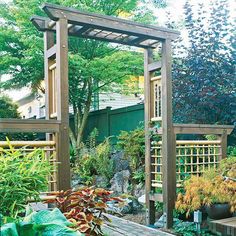 a wooden bench sitting in the middle of a garden