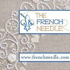 the french needle logo with white lace and blue trim on beige linen fabric, which has been