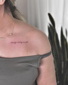 a woman with a tattoo on her shoulder saying, i love you so long and strong